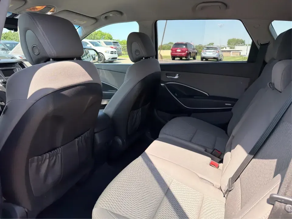 2016 Hyundai Santa Fe SE (KM8SMDHF5GU) with an 3.3L V-6 gasoline direct injection engine, 6A transmission, located at 1184 Kauffman Ave, Fairborn, OH, 45324, (937) 908-9800, 39.807072, -84.030914 - Whether you're hauling the kids to practice in Beavercreek, commuting to Wright-Patterson AFB, or loading up for a weekend escape toward Yellow Springs, this 2016 Hyundai Santa Fe SE is the kind of SUV that fits real life-roomy, confident in changing Ohio weather, and packed with comfort features th - Photo#10