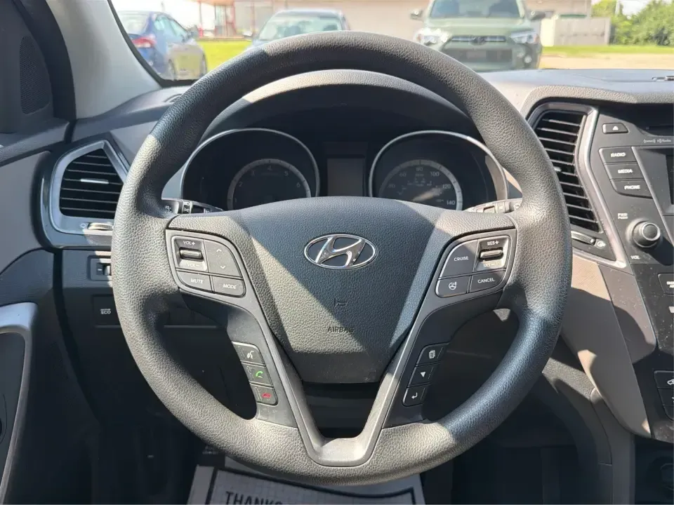 2016 Hyundai Santa Fe SE (KM8SMDHF5GU) with an 3.3L V-6 gasoline direct injection engine, 6A transmission, located at 1184 Kauffman Ave, Fairborn, OH, 45324, (937) 908-9800, 39.807072, -84.030914 - Whether you're hauling the kids to practice in Beavercreek, commuting to Wright-Patterson AFB, or loading up for a weekend escape toward Yellow Springs, this 2016 Hyundai Santa Fe SE is the kind of SUV that fits real life-roomy, confident in changing Ohio weather, and packed with comfort features th - Photo#16