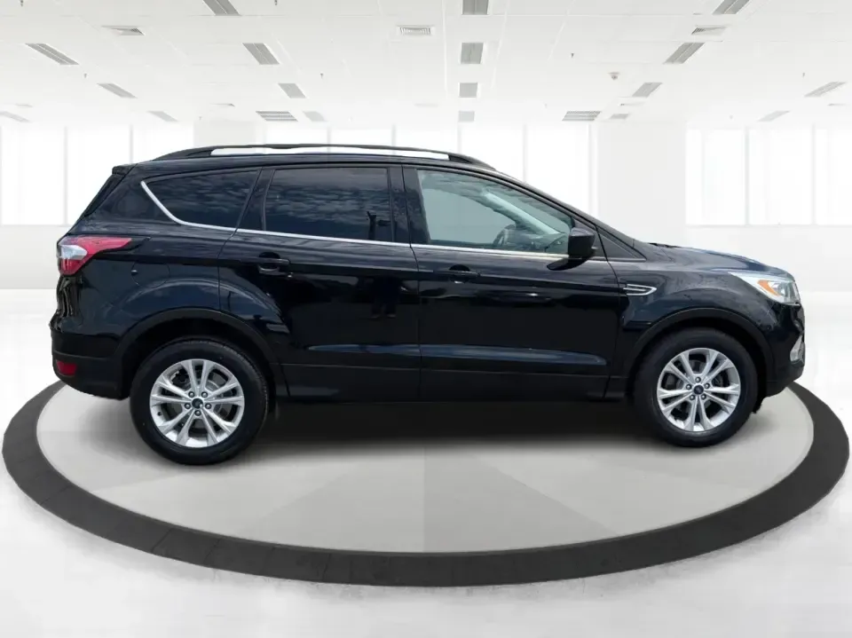 2017 Ford Escape SE (1FMCU0GD1HU) with an 1.5L L4 DOHC 16V engine, 6A transmission, located at 880 E. National Road, Vandalia, OH, 45377, (937) 908-9800, 39.891918, -84.183594 - Picture your next week: a smooth commute down I75, a quick run to the Dayton Mall, and a weekend getaway with room for groceries, gear, and friends-all in one easy-to-drive SUV. This 2017 Ford Escape SE in Shadow Black is a smart fit for busy families, first-time buyers, and anyone who wants a pract - Photo#1