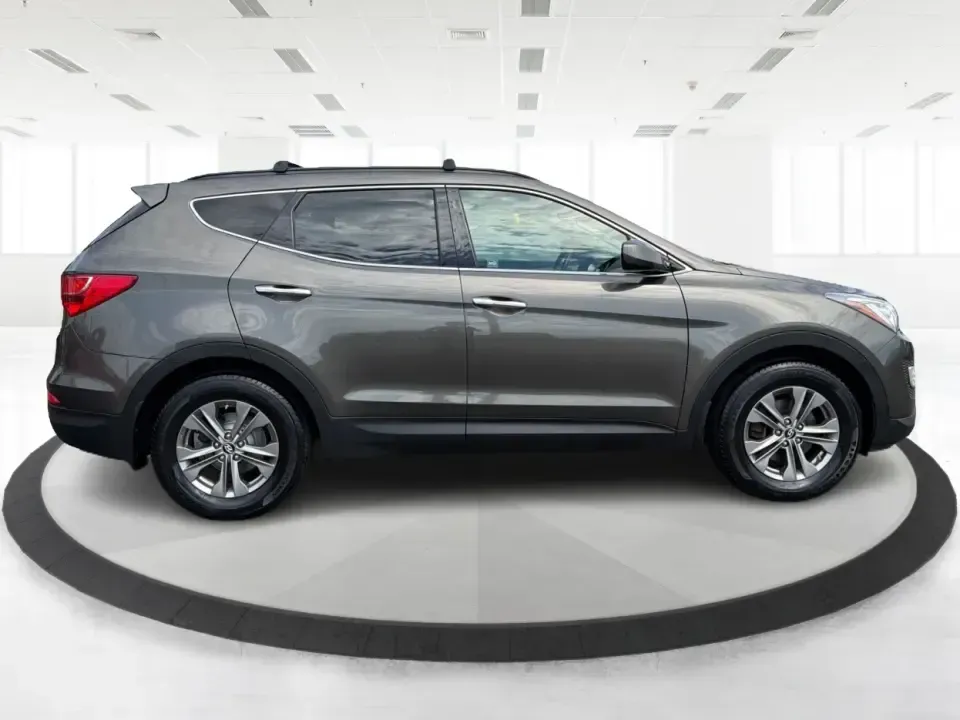 2014 Hyundai Santa Fe Sport 2.4 AWD (5XYZUDLB0EG) with an 2.4L L4 DOHC 16V engine, 6-Speed Automatic transmission, located at 4508 South Dixie Dr, Moraine, OH, 45439, (937) 908-9800, 39.689976, -84.218452 - Picture your next weekend escape: loading up the family, pointing the nose toward the MetroParks, and cruising I-75 with room for everyone and everything-without feeling like you're driving a bus. This 2014 Hyundai Santa Fe 2.4L in Cabo Bronze is a practical, road-trip-ready SUV that fits real life - Photo#1