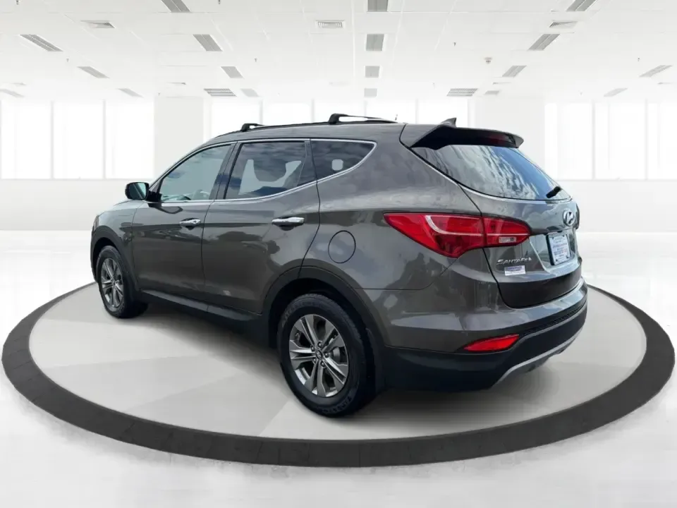 2014 Hyundai Santa Fe Sport 2.4 AWD (5XYZUDLB0EG) with an 2.4L L4 DOHC 16V engine, 6-Speed Automatic transmission, located at 4508 South Dixie Dr, Moraine, OH, 45439, (937) 908-9800, 39.689976, -84.218452 - Picture your next weekend escape: loading up the family, pointing the nose toward the MetroParks, and cruising I-75 with room for everyone and everything-without feeling like you're driving a bus. This 2014 Hyundai Santa Fe 2.4L in Cabo Bronze is a practical, road-trip-ready SUV that fits real life - Photo#4
