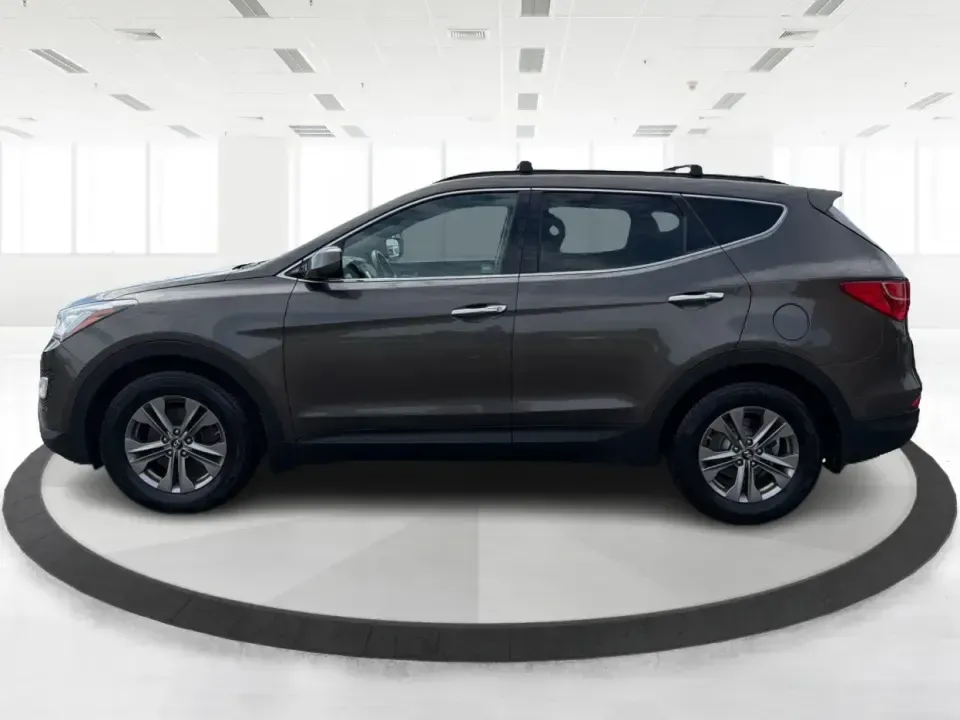 2014 Hyundai Santa Fe Sport 2.4 AWD (5XYZUDLB0EG) with an 2.4L L4 DOHC 16V engine, 6-Speed Automatic transmission, located at 4508 South Dixie Dr, Moraine, OH, 45439, (937) 908-9800, 39.689976, -84.218452 - Picture your next weekend escape: loading up the family, pointing the nose toward the MetroParks, and cruising I-75 with room for everyone and everything-without feeling like you're driving a bus. This 2014 Hyundai Santa Fe 2.4L in Cabo Bronze is a practical, road-trip-ready SUV that fits real life - Photo#5