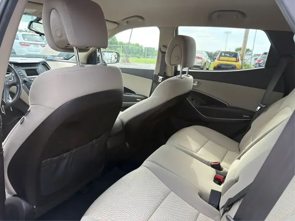 2014 Hyundai Santa Fe Sport 2.4 AWD (5XYZUDLB0EG) with an 2.4L L4 DOHC 16V engine, 6-Speed Automatic transmission, located at 4508 South Dixie Dr, Moraine, OH, 45439, (937) 908-9800, 39.689976, -84.218452 - Picture your next weekend escape: loading up the family, pointing the nose toward the MetroParks, and cruising I-75 with room for everyone and everything-without feeling like you're driving a bus. This 2014 Hyundai Santa Fe 2.4L in Cabo Bronze is a practical, road-trip-ready SUV that fits real life - Photo#10