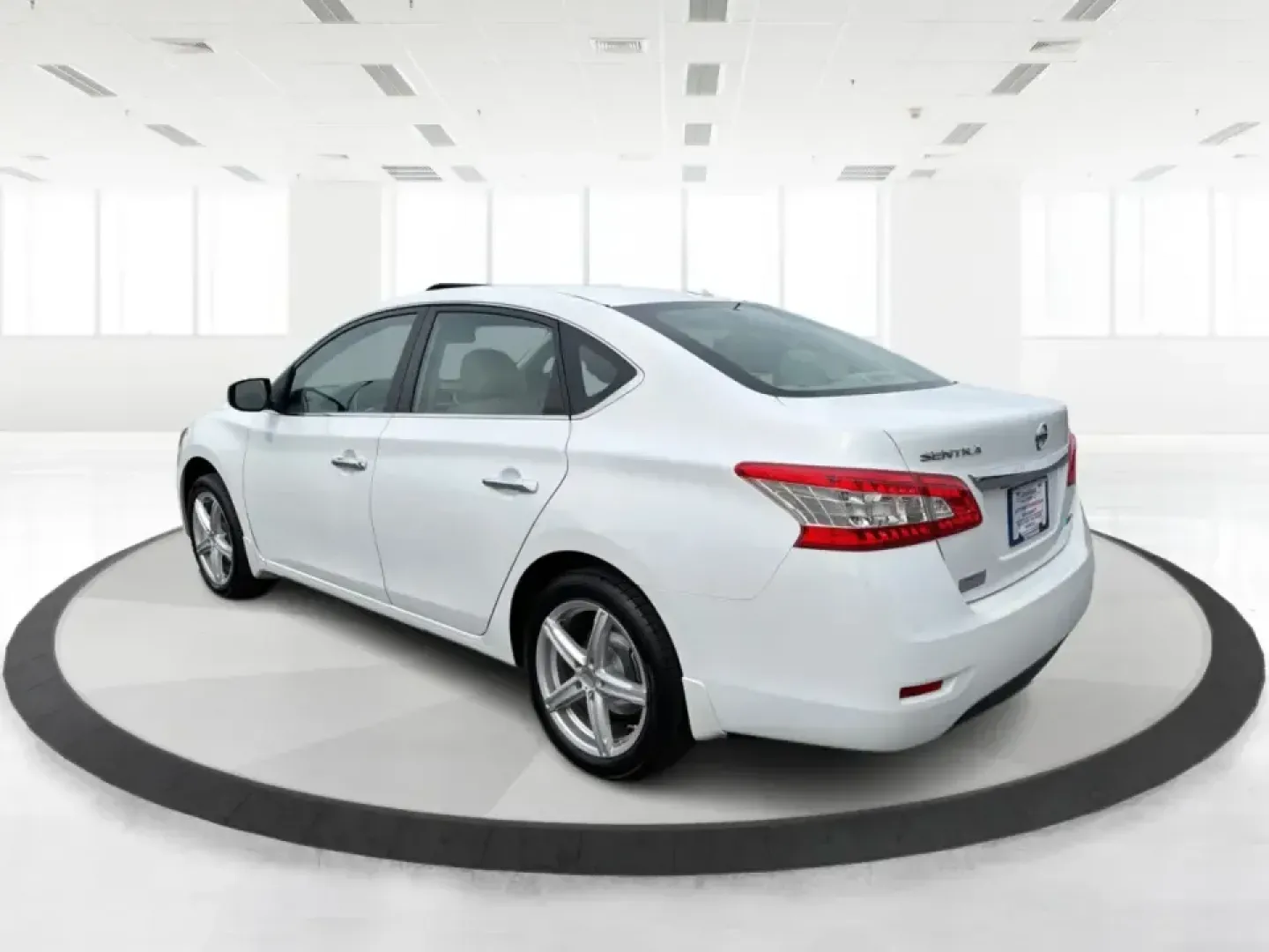 2014 Nissan Sentra SL (3N1AB7AP6EY) with an 1.8L I-4 DOHC engine, 6-Speed Manual transmission, located at 1099 N County Rd 25A , Troy, OH, 45373, (937) 908-9800, 40.057079, -84.212883 - Need a dependable commuter that's easy to park downtown, sips regular unleaded, and still feels comfortable for weekend getaways? This 2014 Nissan Sentra SL in Aspen White is a smart pick for Troy-area drivers who want a practical sedan with upscale touches and a driver-engaged feel thanks to its 6- - Photo#4
