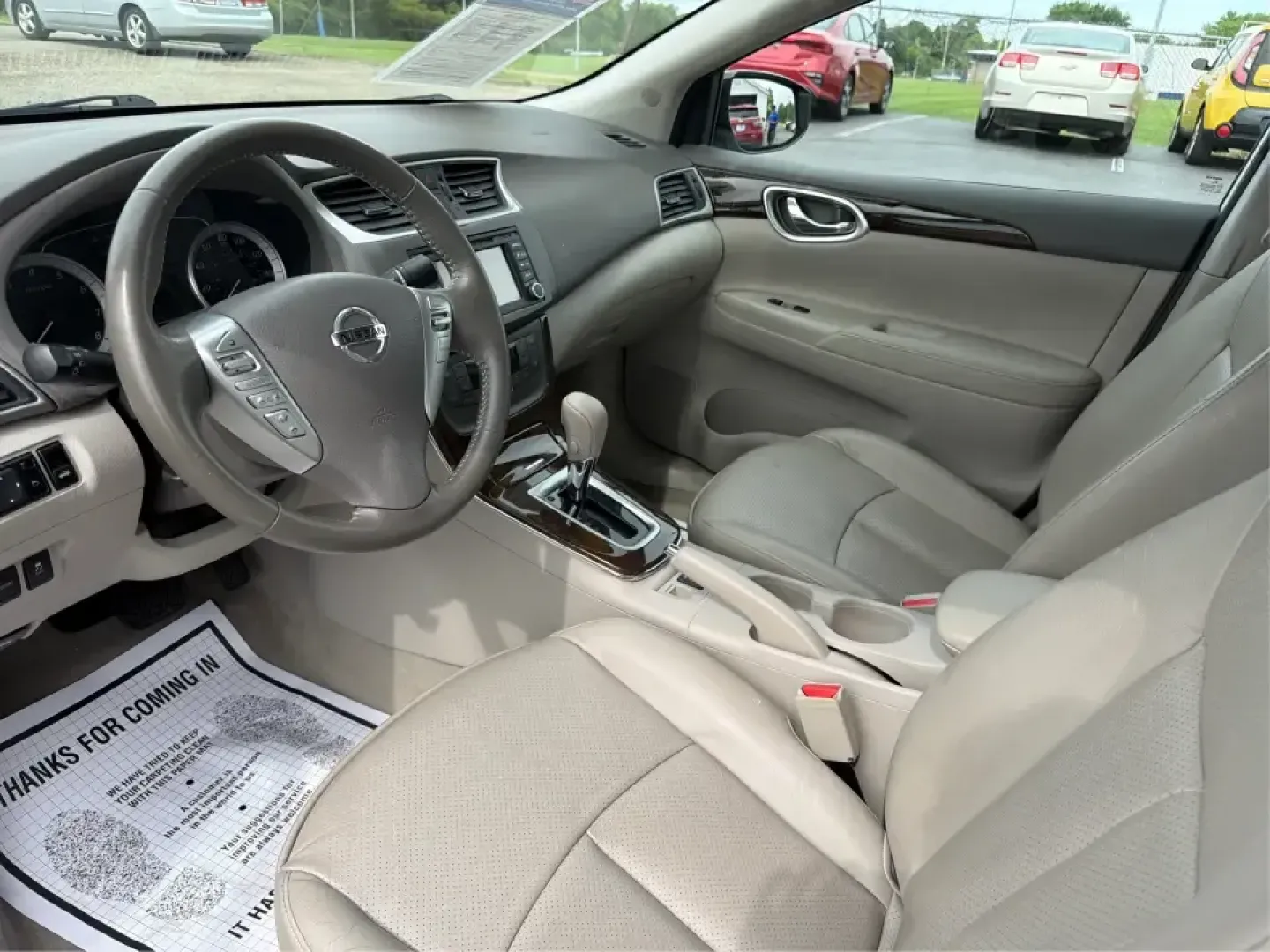 2014 Nissan Sentra SL (3N1AB7AP6EY) with an 1.8L I-4 DOHC engine, 6-Speed Manual transmission, located at 1099 N County Rd 25A , Troy, OH, 45373, (937) 908-9800, 40.057079, -84.212883 - Need a dependable commuter that's easy to park downtown, sips regular unleaded, and still feels comfortable for weekend getaways? This 2014 Nissan Sentra SL in Aspen White is a smart pick for Troy-area drivers who want a practical sedan with upscale touches and a driver-engaged feel thanks to its 6- - Photo#9