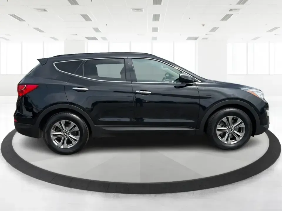 2016 Hyundai Santa Fe 2.4L (5XYZU3LB5GG) with an Theta II 2.4L I-4 gasoline direct injection engine, 6-Speed Automatic transmission, located at 1230 East Main St, Xenia, OH, 45385, (937) 908-9800, 39.688026, -83.910172 - Road-trip ready for Hocking Hills weekends, school-run practical for busy mornings, and comfortable enough for the daily commute down US-35-this 2016 Hyundai Santa Fe 2.4L is the kind of SUV that fits real life in and around Xenia, Ohio. Finished in Twilight Black, it delivers a confident, versatile - Photo#1