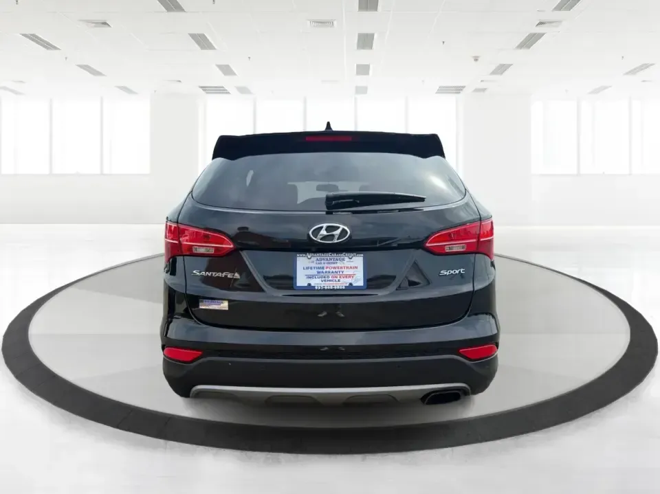 2016 Hyundai Santa Fe 2.4L (5XYZU3LB5GG) with an Theta II 2.4L I-4 gasoline direct injection engine, 6-Speed Automatic transmission, located at 1230 East Main St, Xenia, OH, 45385, (937) 908-9800, 39.688026, -83.910172 - Road-trip ready for Hocking Hills weekends, school-run practical for busy mornings, and comfortable enough for the daily commute down US-35-this 2016 Hyundai Santa Fe 2.4L is the kind of SUV that fits real life in and around Xenia, Ohio. Finished in Twilight Black, it delivers a confident, versatile - Photo#3