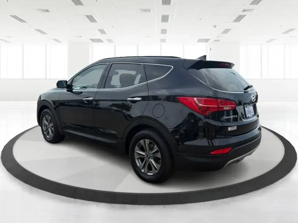 2016 Hyundai Santa Fe 2.4L (5XYZU3LB5GG) with an Theta II 2.4L I-4 gasoline direct injection engine, 6-Speed Automatic transmission, located at 1230 East Main St, Xenia, OH, 45385, (937) 908-9800, 39.688026, -83.910172 - Road-trip ready for Hocking Hills weekends, school-run practical for busy mornings, and comfortable enough for the daily commute down US-35-this 2016 Hyundai Santa Fe 2.4L is the kind of SUV that fits real life in and around Xenia, Ohio. Finished in Twilight Black, it delivers a confident, versatile - Photo#4