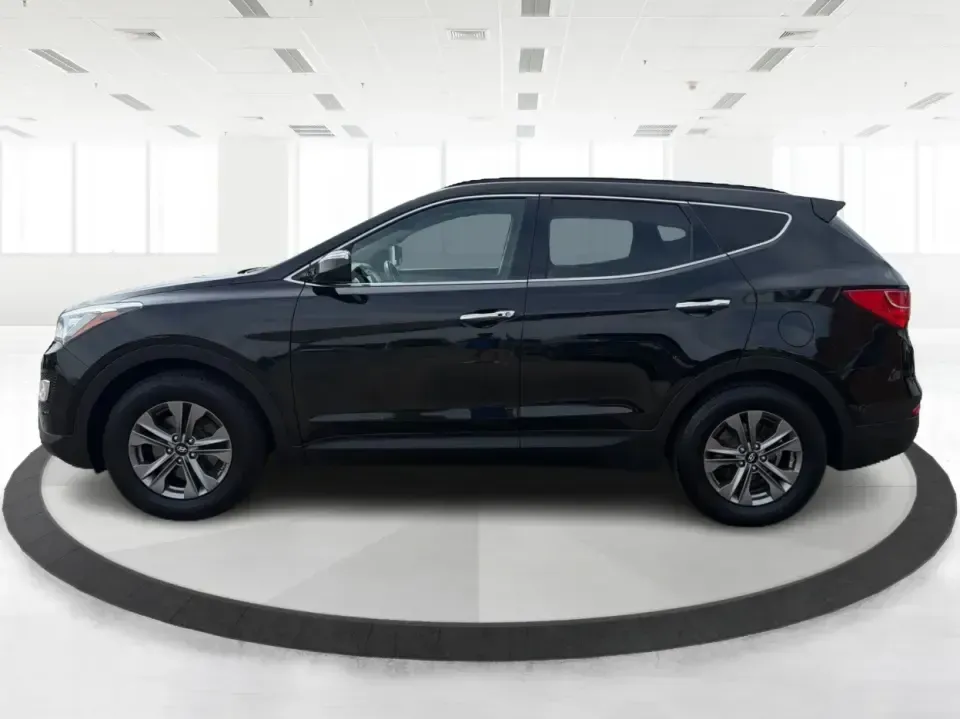 2016 Hyundai Santa Fe 2.4L (5XYZU3LB5GG) with an Theta II 2.4L I-4 gasoline direct injection engine, 6-Speed Automatic transmission, located at 1230 East Main St, Xenia, OH, 45385, (937) 908-9800, 39.688026, -83.910172 - Road-trip ready for Hocking Hills weekends, school-run practical for busy mornings, and comfortable enough for the daily commute down US-35-this 2016 Hyundai Santa Fe 2.4L is the kind of SUV that fits real life in and around Xenia, Ohio. Finished in Twilight Black, it delivers a confident, versatile - Photo#5