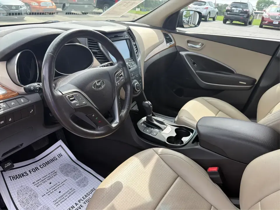 2016 Hyundai Santa Fe 2.4L (5XYZU3LB5GG) with an Theta II 2.4L I-4 gasoline direct injection engine, 6-Speed Automatic transmission, located at 1230 East Main St, Xenia, OH, 45385, (937) 908-9800, 39.688026, -83.910172 - Road-trip ready for Hocking Hills weekends, school-run practical for busy mornings, and comfortable enough for the daily commute down US-35-this 2016 Hyundai Santa Fe 2.4L is the kind of SUV that fits real life in and around Xenia, Ohio. Finished in Twilight Black, it delivers a confident, versatile - Photo#9