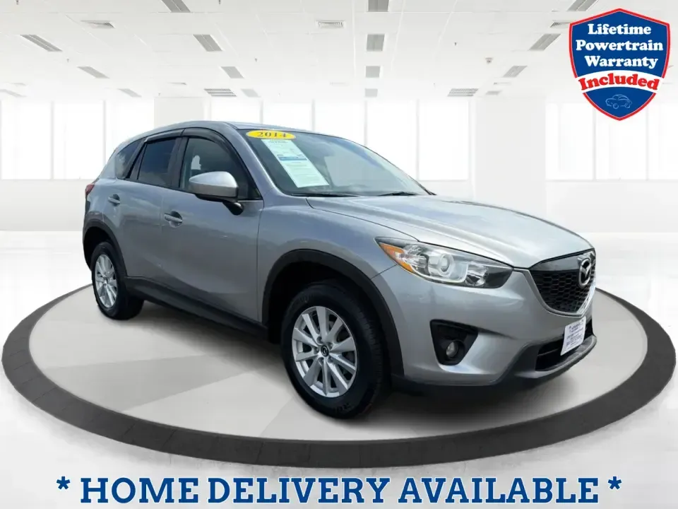 2014 Mazda CX-5 Touring (JM3KE2CYXE0) with an SKYACTIV-G 2.5L I-4 gasoline direct injection engine, 6-Speed Automatic transmission, located at 401 Woodman Dr, Riverside, OH, 45431, (937) 908-9800, 39.760899, -84.123421 - Picture your next weekend: loading up the cargo area for a run to the Riverside MetroPark, heading out for a day trip toward Yellow Springs, or cruising I-675 on a smooth, quiet commute. This 2014 Mazda CX-5 Touring is the kind of compact SUV that fits real life-roomy enough for growing families, ef - Photo#0