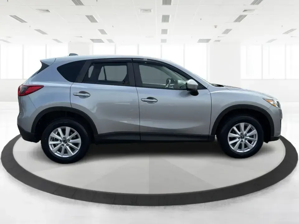 2014 Mazda CX-5 Touring (JM3KE2CYXE0) with an SKYACTIV-G 2.5L I-4 gasoline direct injection engine, 6-Speed Automatic transmission, located at 401 Woodman Dr, Riverside, OH, 45431, (937) 908-9800, 39.760899, -84.123421 - Picture your next weekend: loading up the cargo area for a run to the Riverside MetroPark, heading out for a day trip toward Yellow Springs, or cruising I-675 on a smooth, quiet commute. This 2014 Mazda CX-5 Touring is the kind of compact SUV that fits real life-roomy enough for growing families, ef - Photo#1