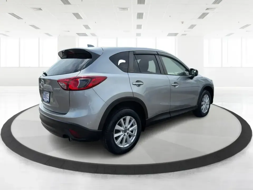 2014 Mazda CX-5 Touring (JM3KE2CYXE0) with an SKYACTIV-G 2.5L I-4 gasoline direct injection engine, 6-Speed Automatic transmission, located at 401 Woodman Dr, Riverside, OH, 45431, (937) 908-9800, 39.760899, -84.123421 - Picture your next weekend: loading up the cargo area for a run to the Riverside MetroPark, heading out for a day trip toward Yellow Springs, or cruising I-675 on a smooth, quiet commute. This 2014 Mazda CX-5 Touring is the kind of compact SUV that fits real life-roomy enough for growing families, ef - Photo#2