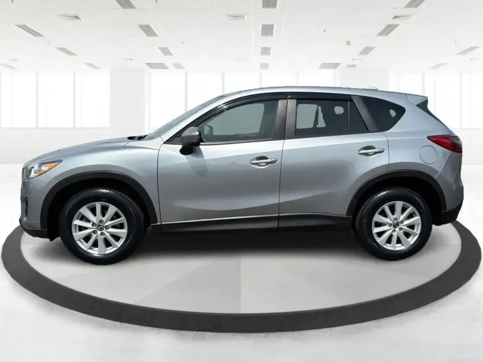 2014 Mazda CX-5 Touring (JM3KE2CYXE0) with an SKYACTIV-G 2.5L I-4 gasoline direct injection engine, 6-Speed Automatic transmission, located at 401 Woodman Dr, Riverside, OH, 45431, (937) 908-9800, 39.760899, -84.123421 - Picture your next weekend: loading up the cargo area for a run to the Riverside MetroPark, heading out for a day trip toward Yellow Springs, or cruising I-675 on a smooth, quiet commute. This 2014 Mazda CX-5 Touring is the kind of compact SUV that fits real life-roomy enough for growing families, ef - Photo#5