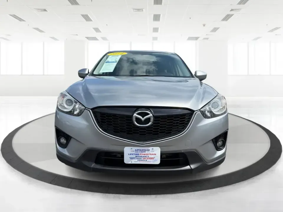 2014 Mazda CX-5 Touring (JM3KE2CYXE0) with an SKYACTIV-G 2.5L I-4 gasoline direct injection engine, 6-Speed Automatic transmission, located at 401 Woodman Dr, Riverside, OH, 45431, (937) 908-9800, 39.760899, -84.123421 - Picture your next weekend: loading up the cargo area for a run to the Riverside MetroPark, heading out for a day trip toward Yellow Springs, or cruising I-675 on a smooth, quiet commute. This 2014 Mazda CX-5 Touring is the kind of compact SUV that fits real life-roomy enough for growing families, ef - Photo#7