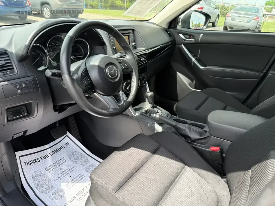 2014 Mazda CX-5 Touring (JM3KE2CYXE0) with an SKYACTIV-G 2.5L I-4 gasoline direct injection engine, 6-Speed Automatic transmission, located at 401 Woodman Dr, Riverside, OH, 45431, (937) 908-9800, 39.760899, -84.123421 - Picture your next weekend: loading up the cargo area for a run to the Riverside MetroPark, heading out for a day trip toward Yellow Springs, or cruising I-675 on a smooth, quiet commute. This 2014 Mazda CX-5 Touring is the kind of compact SUV that fits real life-roomy enough for growing families, ef - Photo#9