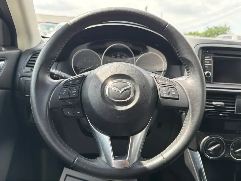 2014 Mazda CX-5 Touring (JM3KE2CYXE0) with an SKYACTIV-G 2.5L I-4 gasoline direct injection engine, 6-Speed Automatic transmission, located at 401 Woodman Dr, Riverside, OH, 45431, (937) 908-9800, 39.760899, -84.123421 - Picture your next weekend: loading up the cargo area for a run to the Riverside MetroPark, heading out for a day trip toward Yellow Springs, or cruising I-675 on a smooth, quiet commute. This 2014 Mazda CX-5 Touring is the kind of compact SUV that fits real life-roomy enough for growing families, ef - Photo#16