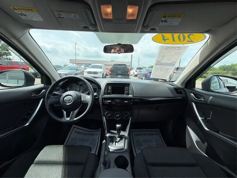 2014 Mazda CX-5 Touring (JM3KE2CYXE0) with an SKYACTIV-G 2.5L I-4 gasoline direct injection engine, 6-Speed Automatic transmission, located at 401 Woodman Dr, Riverside, OH, 45431, (937) 908-9800, 39.760899, -84.123421 - Picture your next weekend: loading up the cargo area for a run to the Riverside MetroPark, heading out for a day trip toward Yellow Springs, or cruising I-675 on a smooth, quiet commute. This 2014 Mazda CX-5 Touring is the kind of compact SUV that fits real life-roomy enough for growing families, ef - Photo#21