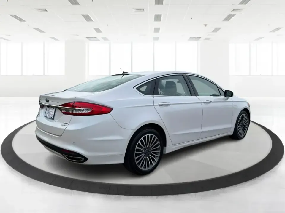2017 Ford Fusion SE (3FA6P0T99HR) with an EcoBoost 2L I-4 gasoline direct injection engine, 6A transmission, located at 1230 East Main St, Xenia, OH, 45385, (937) 908-9800, 39.688026, -83.910172 - Built for real life in the Miami Valley-school drop-offs, long commutes, and weekend getaways-this 2017 Ford Fusion SE is the kind of sedan that fits smoothly into a busy schedule while still feeling comfortable and confident on the road. Finished in crisp Oxford White, it's a smart pick for commute - Photo#2