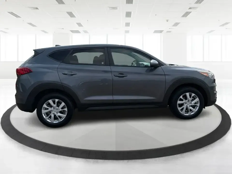 2019 Hyundai Tucson SE AWD (KM8J2CA47KU) with an 2.0L L4 DOHC 16V engine, 6A transmission, located at 1099 N County Rd 25A , Troy, OH, 45373, (937) 908-9800, 40.057079, -84.212883 - Need a dependable SUV that can handle school drop-offs, long commutes up I-75, and spontaneous weekend getaways to Charleston Falls Preserve or a quick lap around the Miami County Fairgrounds? This 2019 Hyundai Tucson SE in Coliseum Gray is a smart, practical choice for drivers who want confident al - Photo#1