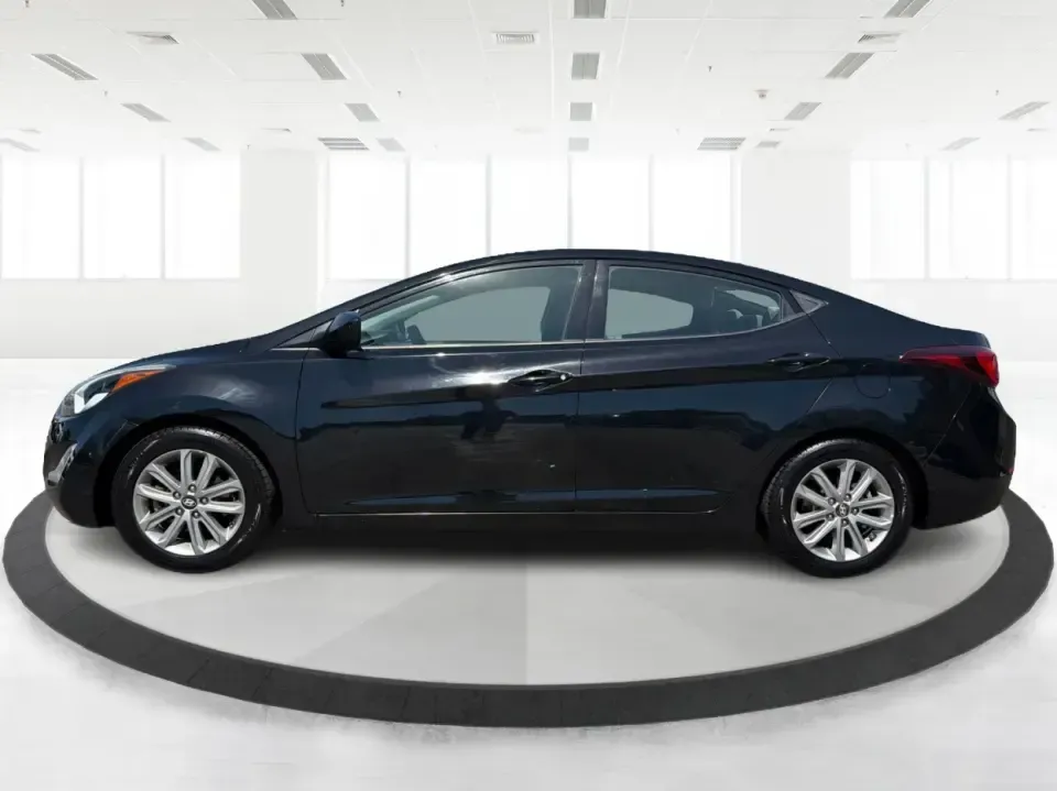 2016 Hyundai Elantra Limited (5NPDH4AE8GH) with an 1.8L L4 DOHC 16V engine, 6-Speed Automatic transmission, located at 4508 South Dixie Dr, Moraine, OH, 45439, (937) 908-9800, 39.689976, -84.218452 - Picture an easy weekday routine: a comfortable, fuel-sipping sedan for the commute down South Dixie Drive, quick school drop-offs, and a smooth Friday escape to Carillon Historical Park or a Dayton Dragons game. This **2016 Hyundai Elantra Limited** in **Phantom Black** is the kind of practical, pol - Photo#5