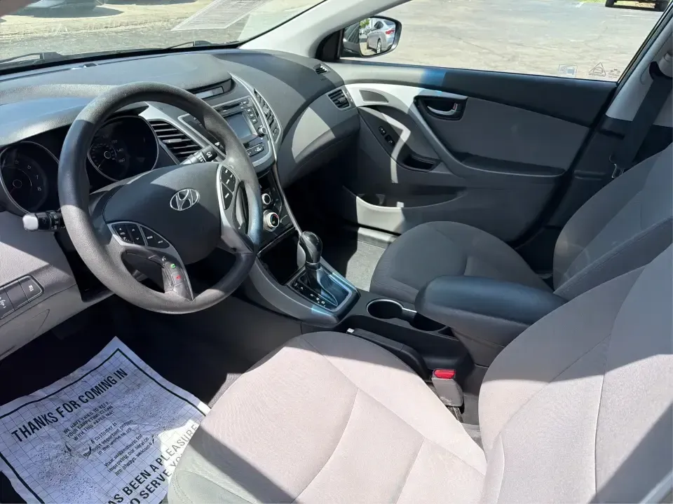 2016 Hyundai Elantra Limited (5NPDH4AE8GH) with an 1.8L L4 DOHC 16V engine, 6-Speed Automatic transmission, located at 4508 South Dixie Dr, Moraine, OH, 45439, (937) 908-9800, 39.689976, -84.218452 - Picture an easy weekday routine: a comfortable, fuel-sipping sedan for the commute down South Dixie Drive, quick school drop-offs, and a smooth Friday escape to Carillon Historical Park or a Dayton Dragons game. This **2016 Hyundai Elantra Limited** in **Phantom Black** is the kind of practical, pol - Photo#9