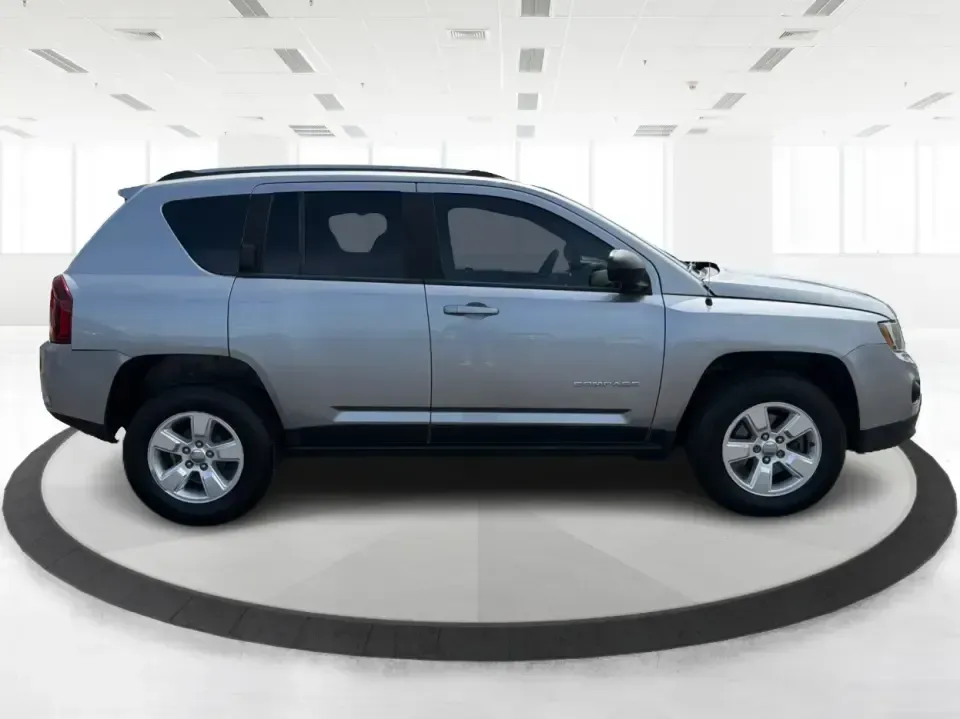 2015 Jeep Compass Sport FWD (1C4NJCBA6FD) with an 2.0L L4 DOHC 16V engine, located at 880 E. National Road, Vandalia, OH, 45377, (937) 908-9800, 39.891918, -84.183594 - Weekday commutes down I75, school drop-offs in Butler Township, and quick weekend getaways to the National Museum of the U.S. Air Force or Taylorsville MetroPark all call for an SUV that's easy to live with, comfortable for five, and efficient enough to keep your budget in check. This **2015 Jeep Co - Photo#1