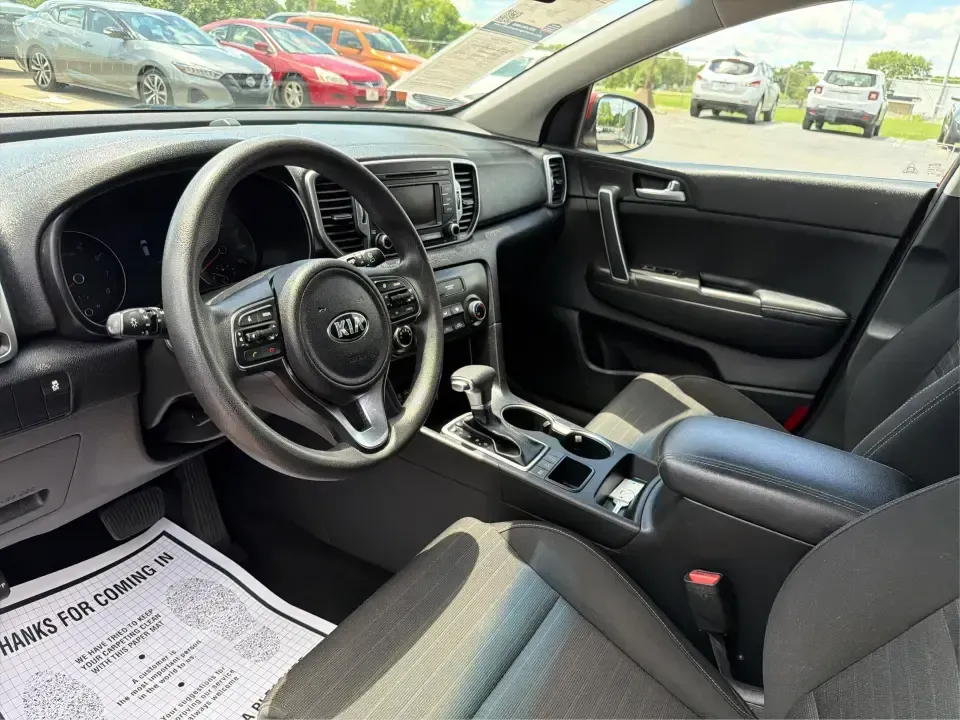 2018 Kia Sportage LX AWD (KNDPMCACXJ7) with an 2.4L V6 DOHC 24V engine, 6A transmission, located at 4508 South Dixie Dr, Moraine, OH, 45439, (937) 908-9800, 39.689976, -84.218452 - Need a capable crossover for Midwest weather, daily commutes, and spontaneous weekend plans-without the stress that can come with traditional lending? This **2018 Kia Sportage LX AWD** in bold **Hyper Red** fits an active Moraine/Dayton lifestyle, whether you're shuttling kids to practice, commuting - Photo#9