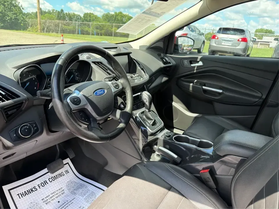 2014 Ford Escape Titanium 4WD (1FMCU9J91EU) with an 2.0L L4 DOHC 16V engine, 6-Speed Automatic transmission, located at 1099 N County Rd 25A , Troy, OH, 45373, (937) 908-9800, 40.057079, -84.212883 - Weekend getaways to Hocking Hills, snowy commutes up I75, or the everyday school-and-grocery loop around Troy-this 2014 Ford Escape Titanium 4WD is built for the kind of life that doesn't slow down when the weather changes. With seating for five, flexible cargo space, and confident four-wheel drive,- Photo#9