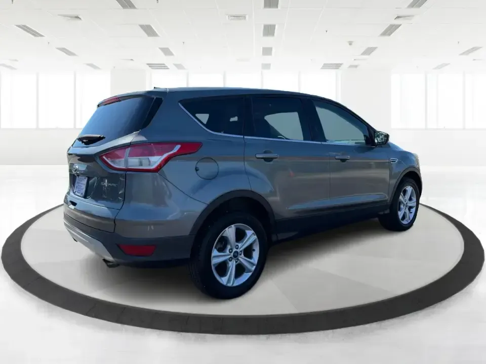 2014 Ford Escape SE 4WD (1FMCU9G93EU) with an 2.0L L4 DOHC 16V engine, 6-Speed Automatic transmission, located at 1951 S Dayton Lakeview Rd., New Carlisle, OH, 45344, (937) 908-9800, 39.890999, -84.050255 - Ready for real-life Ohio driving-school drop-offs, long commutes, and weekend getaways-this 2014 Ford Escape SE 4WD is the kind of compact SUV that fits a busy lifestyle without feeling bulky. Whether you're cruising I-70 toward Dayton, running errands along S Dayton-Lakeview Rd, or packing up for a- Photo#2
