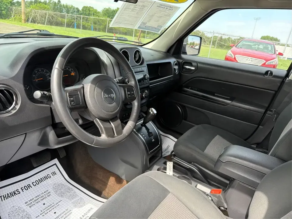 2014 Jeep Patriot Latitude 4WD (1C4NJRFB6ED) with an 2.4L L4 DOHC 16V engine, located at 8750 N County Rd 25A, Piqua, OH, 45356, (937) 908-9800, 40.164391, -84.232513 - Weekend escapes to Indian Lake, snowy commutes up I75, or everyday school-and-grocery runs around Miami County-this 2014 Jeep Patriot Latitude 4WD is built for the kind of life that doesn't stop when the weather changes. With classic Jeep SUV practicality, seating for 5, and confident four-wheel dri- Photo#9
