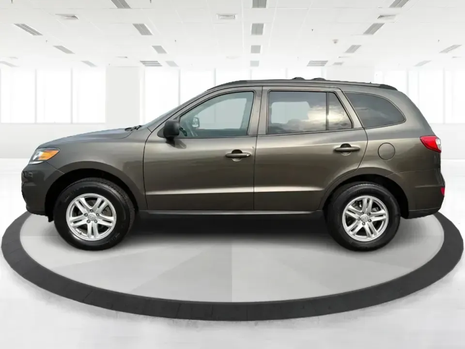 2012 Hyundai Santa Fe GLS 2.4 FWD (5XYZG3AB8CG) with an 2.4L L4 DOHC 16V engine, 6-Speed Automatic transmission, located at 8750 N County Rd 25A, Piqua, OH, 45356, (937) 908-9800, 40.164391, -84.232513 - Picture an easy weekend getaway: you load the cooler, fold the second-row seats for extra gear, and head out of Piqua toward Indian Lake or a day trip through the Miami Valley-without needing a giant SUV. This 2012 Hyundai Santa Fe GLS 2.4 is a practical, five-passenger SUV that fits real life, whet- Photo#5