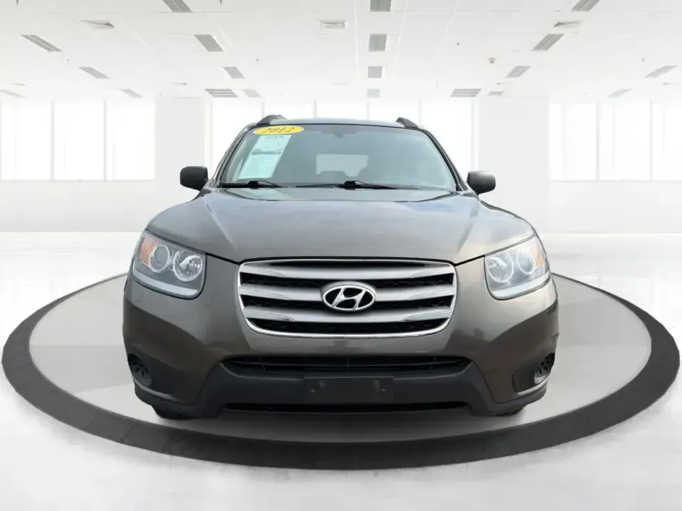 2012 Hyundai Santa Fe GLS 2.4 FWD (5XYZG3AB8CG) with an 2.4L L4 DOHC 16V engine, 6-Speed Automatic transmission, located at 8750 N County Rd 25A, Piqua, OH, 45356, (937) 908-9800, 40.164391, -84.232513 - Picture an easy weekend getaway: you load the cooler, fold the second-row seats for extra gear, and head out of Piqua toward Indian Lake or a day trip through the Miami Valley-without needing a giant SUV. This 2012 Hyundai Santa Fe GLS 2.4 is a practical, five-passenger SUV that fits real life, whet- Photo#7