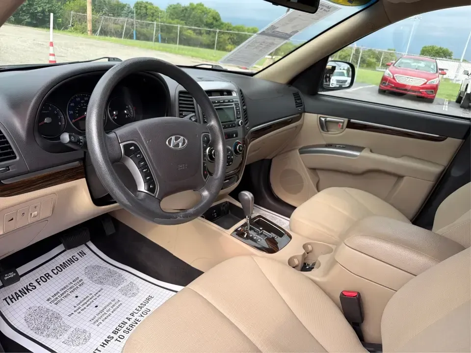 2012 Hyundai Santa Fe GLS 2.4 FWD (5XYZG3AB8CG) with an 2.4L L4 DOHC 16V engine, 6-Speed Automatic transmission, located at 8750 N County Rd 25A, Piqua, OH, 45356, (937) 908-9800, 40.164391, -84.232513 - Picture an easy weekend getaway: you load the cooler, fold the second-row seats for extra gear, and head out of Piqua toward Indian Lake or a day trip through the Miami Valley-without needing a giant SUV. This 2012 Hyundai Santa Fe GLS 2.4 is a practical, five-passenger SUV that fits real life, whet- Photo#9