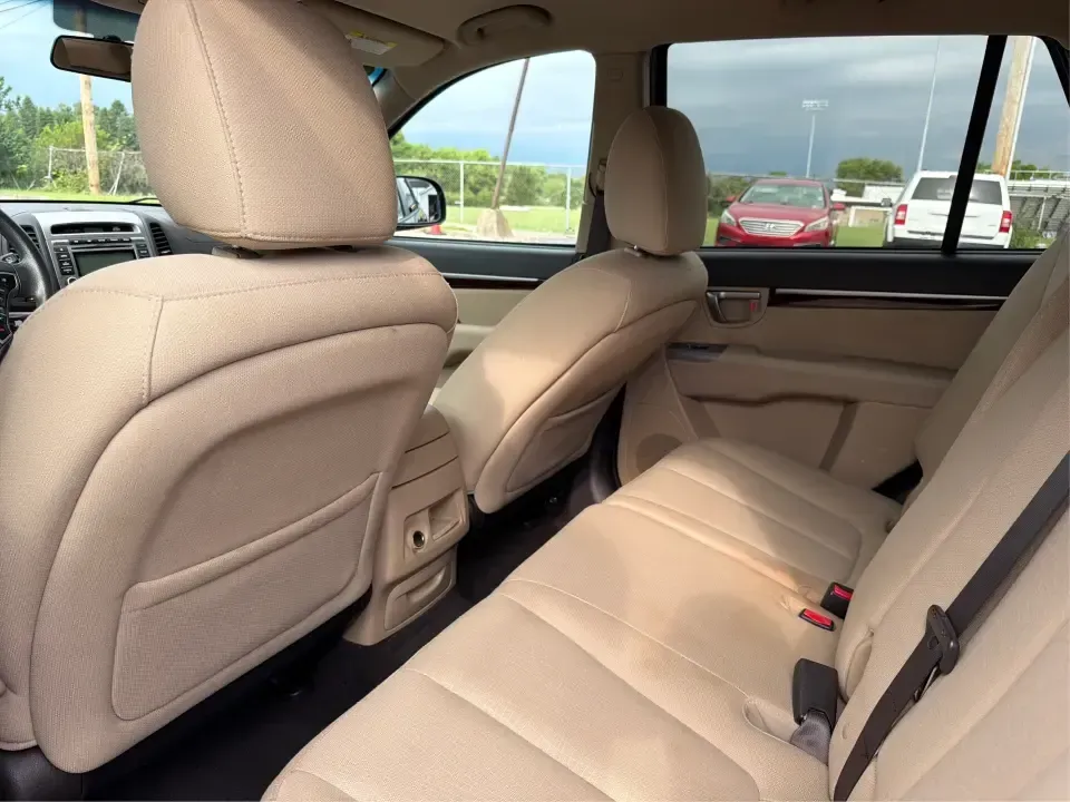 2012 Hyundai Santa Fe GLS 2.4 FWD (5XYZG3AB8CG) with an 2.4L L4 DOHC 16V engine, 6-Speed Automatic transmission, located at 8750 N County Rd 25A, Piqua, OH, 45356, (937) 908-9800, 40.164391, -84.232513 - Picture an easy weekend getaway: you load the cooler, fold the second-row seats for extra gear, and head out of Piqua toward Indian Lake or a day trip through the Miami Valley-without needing a giant SUV. This 2012 Hyundai Santa Fe GLS 2.4 is a practical, five-passenger SUV that fits real life, whet- Photo#10
