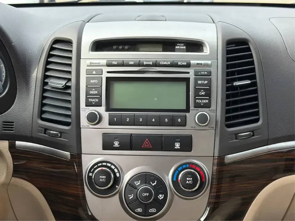 2012 Hyundai Santa Fe GLS 2.4 FWD (5XYZG3AB8CG) with an 2.4L L4 DOHC 16V engine, 6-Speed Automatic transmission, located at 8750 N County Rd 25A, Piqua, OH, 45356, (937) 908-9800, 40.164391, -84.232513 - Picture an easy weekend getaway: you load the cooler, fold the second-row seats for extra gear, and head out of Piqua toward Indian Lake or a day trip through the Miami Valley-without needing a giant SUV. This 2012 Hyundai Santa Fe GLS 2.4 is a practical, five-passenger SUV that fits real life, whet- Photo#13