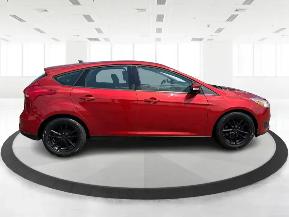 2018 Ford Focus SE (1FADP3K27JL) with an 2L I-4 gasoline direct injection engine, Automatic transmission, located at 4508 South Dixie Dr, Moraine, OH, 45439, (937) 908-9800, 39.689976, -84.218452 - Need a practical, fun-to-drive hatchback for the daily commute down South Dixie Drive, quick errands near Dayton Mall, or an easy weekend escape to Carillon Historical Park? This 2018 Ford Focus SE in eye-catching Hot Pepper Red Metallic Tinted Clearcoat fits real life in Moraine, Ohio-compact enoug- Photo#1