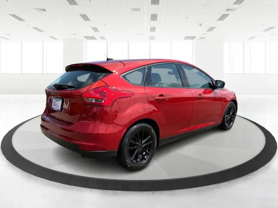 2018 Ford Focus SE (1FADP3K27JL) with an 2L I-4 gasoline direct injection engine, Automatic transmission, located at 4508 South Dixie Dr, Moraine, OH, 45439, (937) 908-9800, 39.689976, -84.218452 - Need a practical, fun-to-drive hatchback for the daily commute down South Dixie Drive, quick errands near Dayton Mall, or an easy weekend escape to Carillon Historical Park? This 2018 Ford Focus SE in eye-catching Hot Pepper Red Metallic Tinted Clearcoat fits real life in Moraine, Ohio-compact enoug- Photo#2