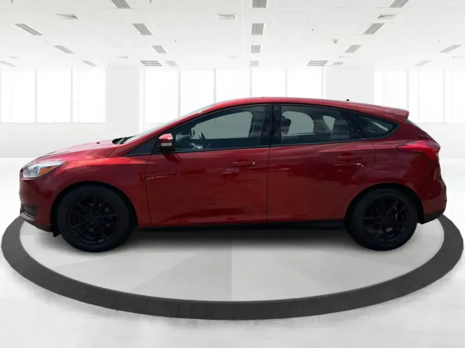 2018 Ford Focus SE (1FADP3K27JL) with an 2L I-4 gasoline direct injection engine, Automatic transmission, located at 4508 South Dixie Dr, Moraine, OH, 45439, (937) 908-9800, 39.689976, -84.218452 - Need a practical, fun-to-drive hatchback for the daily commute down South Dixie Drive, quick errands near Dayton Mall, or an easy weekend escape to Carillon Historical Park? This 2018 Ford Focus SE in eye-catching Hot Pepper Red Metallic Tinted Clearcoat fits real life in Moraine, Ohio-compact enoug- Photo#5