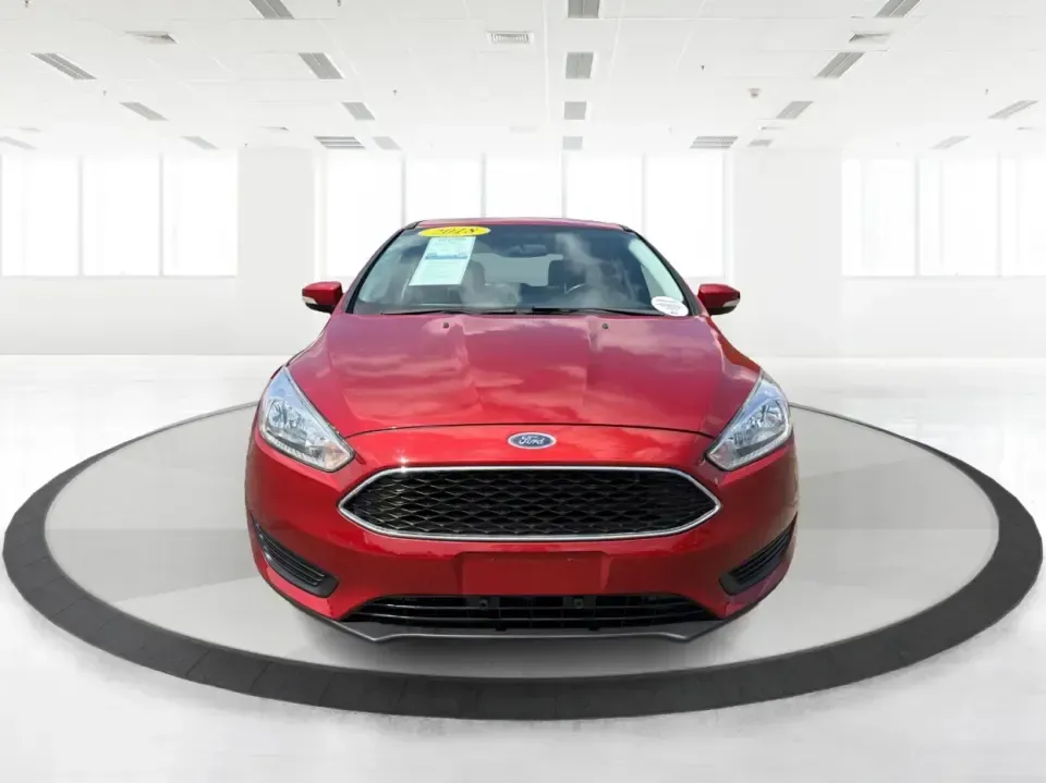 2018 Ford Focus SE (1FADP3K27JL) with an 2L I-4 gasoline direct injection engine, Automatic transmission, located at 4508 South Dixie Dr, Moraine, OH, 45439, (937) 908-9800, 39.689976, -84.218452 - Need a practical, fun-to-drive hatchback for the daily commute down South Dixie Drive, quick errands near Dayton Mall, or an easy weekend escape to Carillon Historical Park? This 2018 Ford Focus SE in eye-catching Hot Pepper Red Metallic Tinted Clearcoat fits real life in Moraine, Ohio-compact enoug- Photo#7