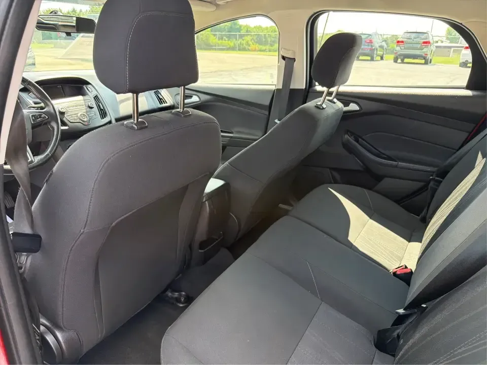 2018 Ford Focus SE (1FADP3K27JL) with an 2L I-4 gasoline direct injection engine, Automatic transmission, located at 4508 South Dixie Dr, Moraine, OH, 45439, (937) 908-9800, 39.689976, -84.218452 - Need a practical, fun-to-drive hatchback for the daily commute down South Dixie Drive, quick errands near Dayton Mall, or an easy weekend escape to Carillon Historical Park? This 2018 Ford Focus SE in eye-catching Hot Pepper Red Metallic Tinted Clearcoat fits real life in Moraine, Ohio-compact enoug- Photo#10
