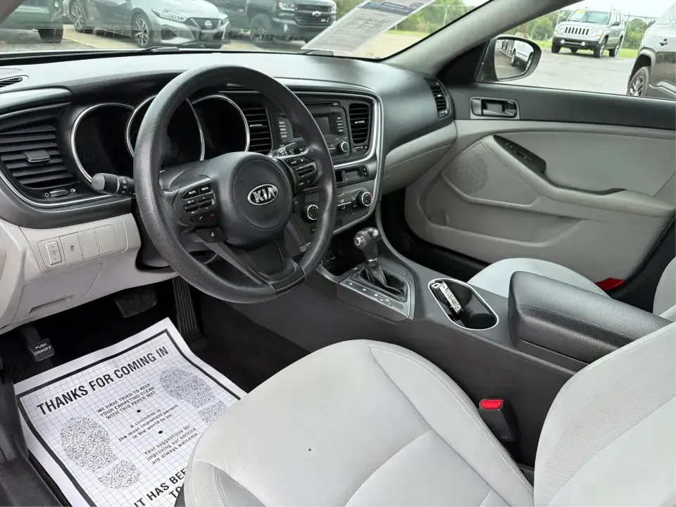 2014 Kia Optima 2.4 LX STD/Conv (5XXGM4A77EG) with an Theta II 2.4L I-4 gasoline direct injection engine, located at 8750 N County Rd 25A, Piqua, OH, 45356, (937) 908-9800, 40.164391, -84.232513 - Picture your next week: a smooth, fuel-sipping commute down I-75, a quick run to Miami Valley Centre Mall, and a comfortable evening drive through downtown Piqua-without giving up style or practicality. This 2014 Kia Optima 2.4 LX (STD/Conv) in Satin Metal is a smart sedan for real life: roomy enoug- Photo#9