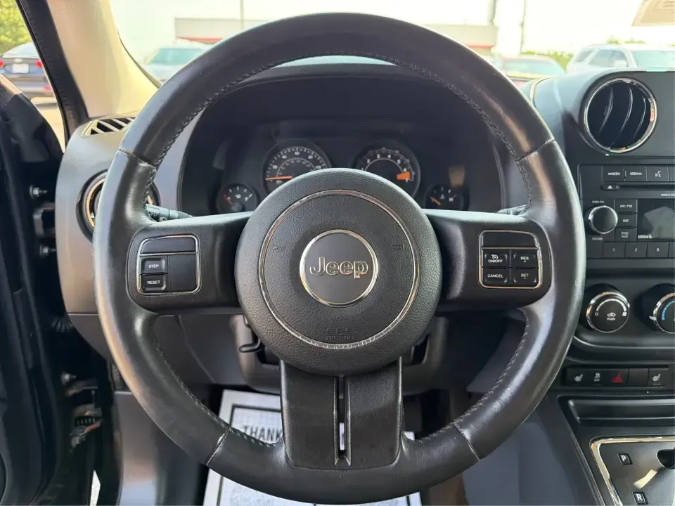 2014 Jeep Patriot Latitude 2WD (1C4NJPFA2ED) with an 2.0L L4 DOHC 16V engine, located at 8750 N County Rd 25A, Piqua, OH, 45356, (937) 908-9800, 40.164391, -84.232513 - Need a practical SUV for school runs, daily commutes to Troy or Dayton, and spontaneous weekend getaways without stretching the budget? This **2014 Jeep Patriot Latitude 2WD** is a smart, flexible choice for drivers who want SUV space, easy-to-live-with comfort, and a straightforward ownership exper- Photo#16