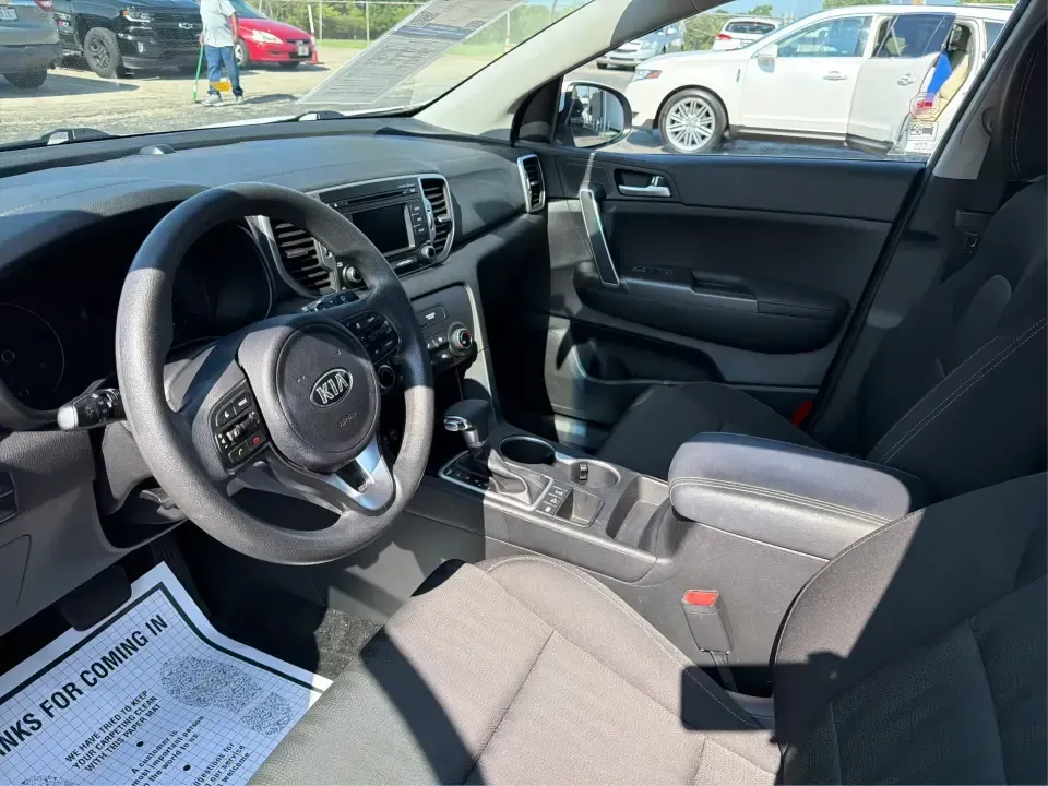 2017 Kia Sportage LX AWD (KNDPMCAC5H7) with an 2.4L V6 DOHC 24V engine, 6-Speed Automatic transmission, located at 1184 Kauffman Ave, Fairborn, OH, 45324, (937) 908-9800, 39.807072, -84.030914 - Weekend getaways to John Bryan State Park, snowy school runs, or the daily commute down I675-this 2017 Kia Sportage LX AWD is built for real life in the Miami Valley. With confident all-wheel drive and SUV versatility, it's a smart pick for drivers who want a practical crossover that can handle Ohio- Photo#9