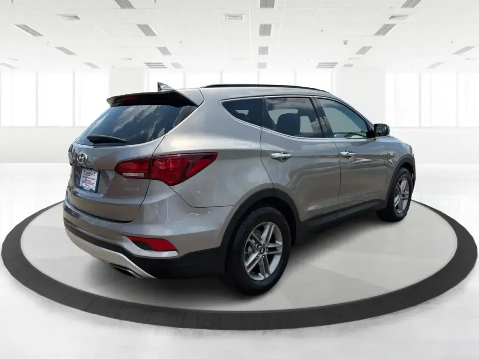 2017 Hyundai Santa Fe Sport 2.4 FWD (5XYZU3LBXHG) with an 2.4L L4 DOHC 16V engine, 6-Speed Automatic transmission, located at 1099 N County Rd 25A , Troy, OH, 45373, (937) 908-9800, 40.057079, -84.212883 - Pack the kids for school drop-off, load up groceries for the week, and still have room for a spontaneous weekend escape-this 2017 Hyundai Santa Fe Sport is built for real life in Troy, Ohio. With SUV practicality, comfortable seating, and the kind of everyday tech that makes commuting smoother, it's- Photo#2