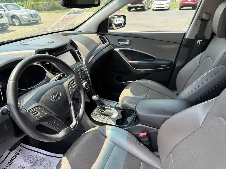 2017 Hyundai Santa Fe Sport 2.4 FWD (5XYZU3LBXHG) with an 2.4L L4 DOHC 16V engine, 6-Speed Automatic transmission, located at 1099 N County Rd 25A , Troy, OH, 45373, (937) 908-9800, 40.057079, -84.212883 - Pack the kids for school drop-off, load up groceries for the week, and still have room for a spontaneous weekend escape-this 2017 Hyundai Santa Fe Sport is built for real life in Troy, Ohio. With SUV practicality, comfortable seating, and the kind of everyday tech that makes commuting smoother, it's- Photo#9