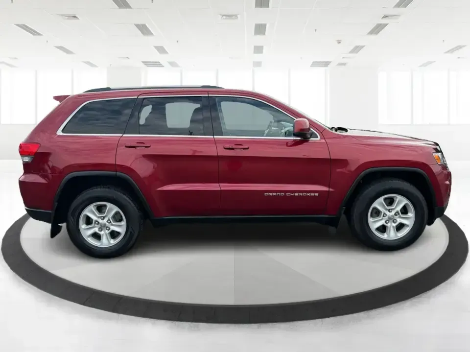 2014 Jeep Grand Cherokee Laredo 4WD (1C4RJFAG9EC) with an 3.6L V6 DOHC 24V engine, 5-Speed Automatic transmission, located at 1099 N County Rd 25A , Troy, OH, 45373, (937) 908-9800, 40.057079, -84.212883 - Picture your next Ohio weekend: the kids and gear loaded up, a cooler in the back, and you cruising out of Troy toward Charleston Falls Preserve or a fall drive through the Miami County countryside-confident that changing weather and back roads won't change your plans. This 2014 Jeep Grand Cherokee- Photo#1