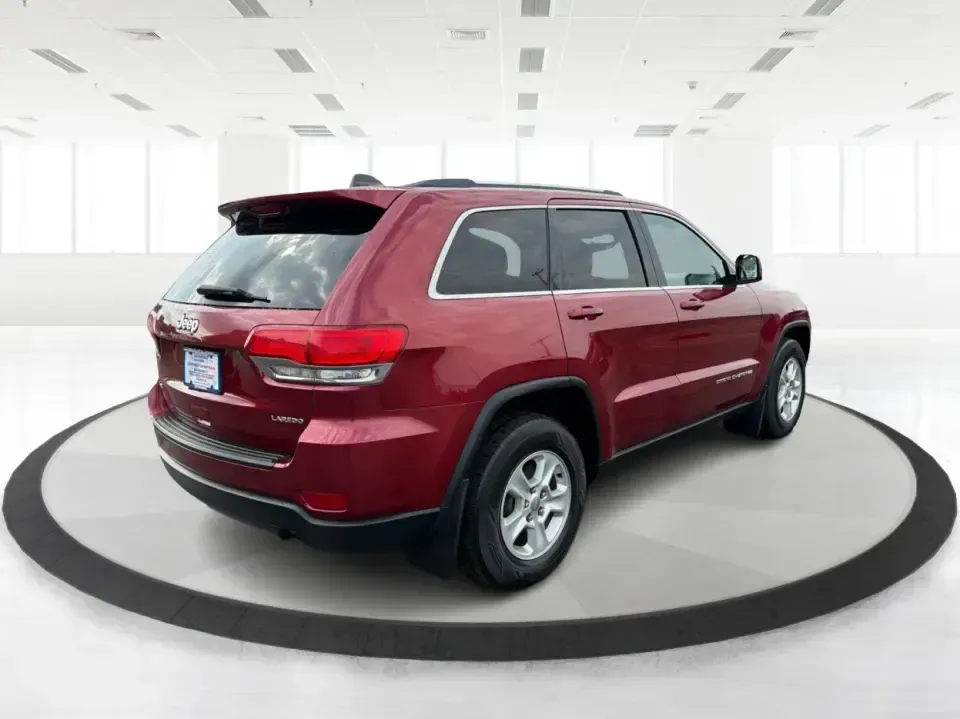 2014 Jeep Grand Cherokee Laredo 4WD (1C4RJFAG9EC) with an 3.6L V6 DOHC 24V engine, 5-Speed Automatic transmission, located at 1099 N County Rd 25A , Troy, OH, 45373, (937) 908-9800, 40.057079, -84.212883 - Picture your next Ohio weekend: the kids and gear loaded up, a cooler in the back, and you cruising out of Troy toward Charleston Falls Preserve or a fall drive through the Miami County countryside-confident that changing weather and back roads won't change your plans. This 2014 Jeep Grand Cherokee- Photo#2