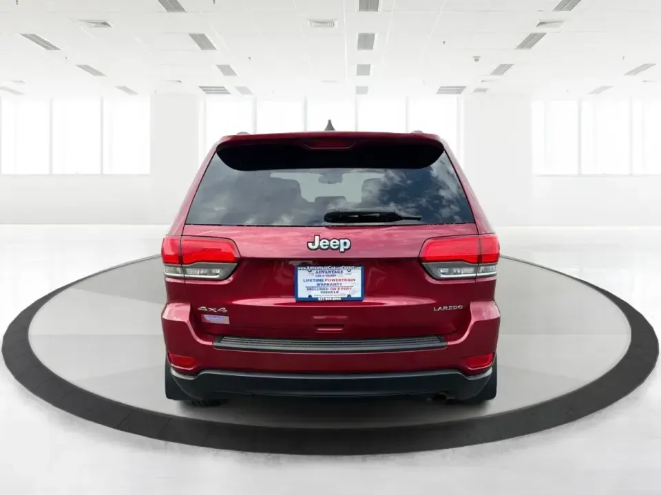 2014 Jeep Grand Cherokee Laredo 4WD (1C4RJFAG9EC) with an 3.6L V6 DOHC 24V engine, 5-Speed Automatic transmission, located at 1099 N County Rd 25A , Troy, OH, 45373, (937) 908-9800, 40.057079, -84.212883 - Picture your next Ohio weekend: the kids and gear loaded up, a cooler in the back, and you cruising out of Troy toward Charleston Falls Preserve or a fall drive through the Miami County countryside-confident that changing weather and back roads won't change your plans. This 2014 Jeep Grand Cherokee- Photo#3