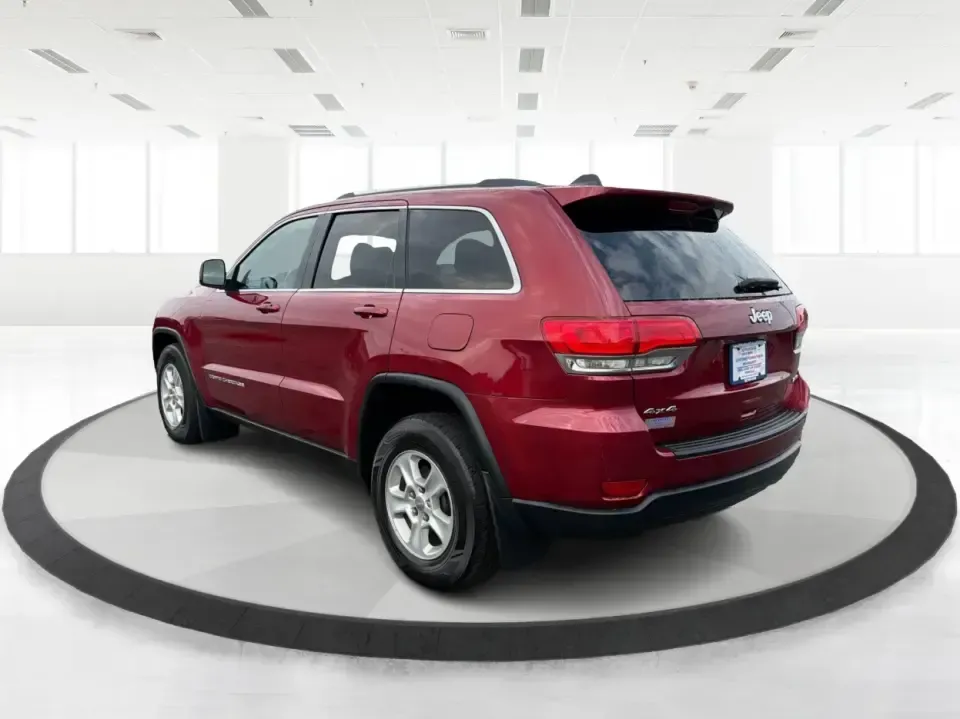 2014 Jeep Grand Cherokee Laredo 4WD (1C4RJFAG9EC) with an 3.6L V6 DOHC 24V engine, 5-Speed Automatic transmission, located at 1099 N County Rd 25A , Troy, OH, 45373, (937) 908-9800, 40.057079, -84.212883 - Picture your next Ohio weekend: the kids and gear loaded up, a cooler in the back, and you cruising out of Troy toward Charleston Falls Preserve or a fall drive through the Miami County countryside-confident that changing weather and back roads won't change your plans. This 2014 Jeep Grand Cherokee- Photo#4